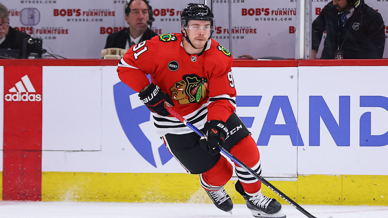 CHICAGO, IL - DECEMBER 27: Anthony Beauvillier #91 of the Chicago Blackhawks brings the puck up ice during the first period against the Winnipeg Jets at the United Center on December 27, 2023 in Chicago, Illinois.