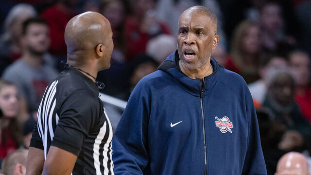 CINCINNATI, OH - DECEMBER 21: Head coach Mike Davis of the Detroit Mercy Titans talks with a referee during the game against the Cincinnati Bearcats at Fifth Third Arena on December 21, 2022 in Cincinnati, Ohio.