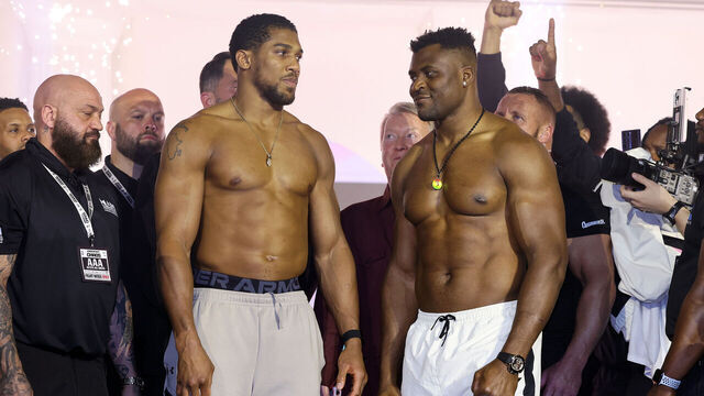 RIYADH, SAUDI ARABIA - MARCH 07: Anthony Joshua (L) and Francis Ngannou (R) interact at the weigh-in ahead of their 'Knockout Chaos' heavyweight fight at Greece in Boulevard World on March 07, 2024 in Riyadh, Saudi Arabia.