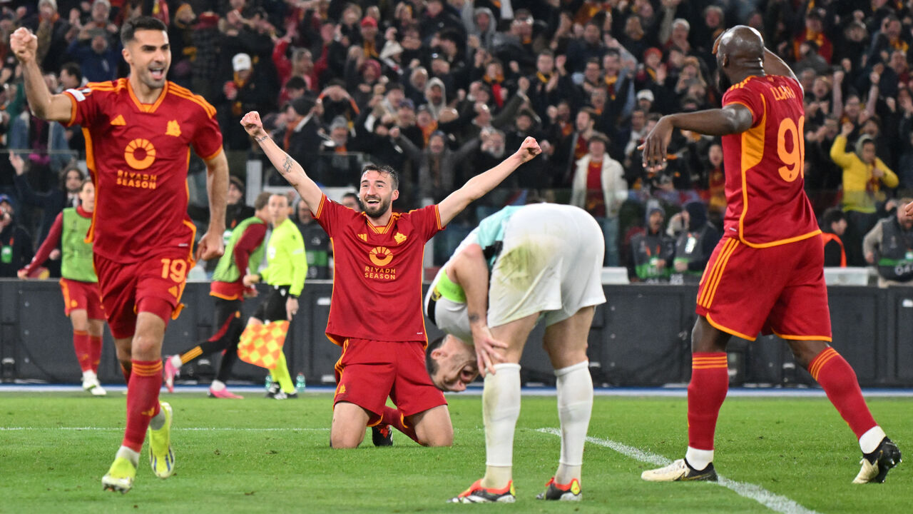 Roma's Italian midfielder #04 Bryan Cristante (2L) kneels on the ground as he celebrates scoring Roma's fourth goal during the UEFA Europa League last 16 first leg football match between AS Roma and Brighton and Hove Albion at the Olympic Stadium in Rome on March 7, 2024.
