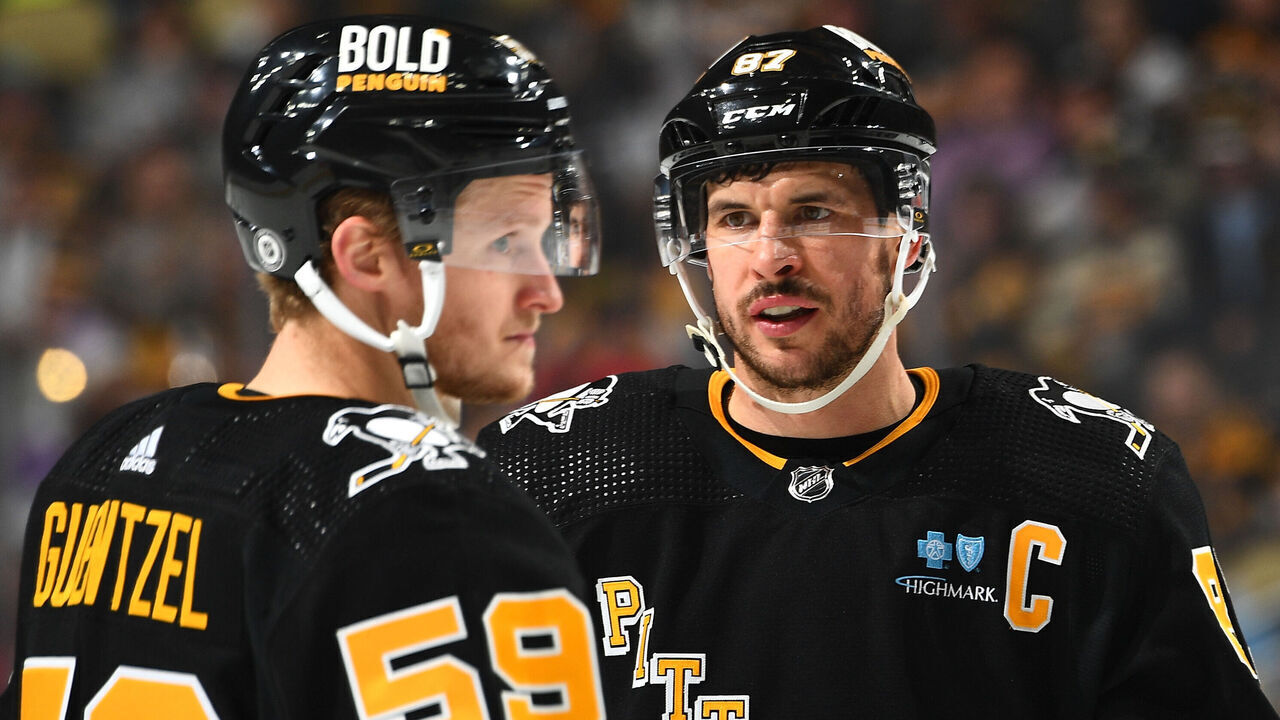 PITTSBURGH, PA - NOVEMBER 16: Sidney Crosby #87 talks with Jake Guentzel #59 of the Pittsburgh Penguins during the game against the New Jersey Devils at PPG PAINTS Arena on November 16, 2023 in Pittsburgh, Pennsylvania.