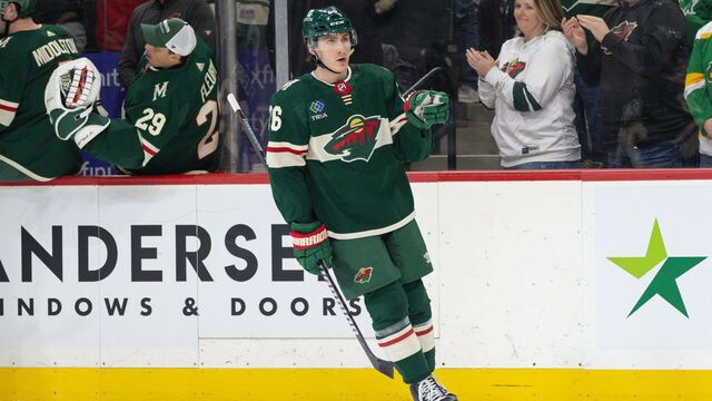 Saint Paul, MN - FEBRUARY 27: Minnesota Wild center Connor Dewar (26) points to goaltender Filip Gustavsson (32) after scoring a goal during the first period of an NHL game between the Carolina Hurricanes and Minnesota Wild on February 27th, 2024, at the Xcel Energy Center in Saint Paul, MN.