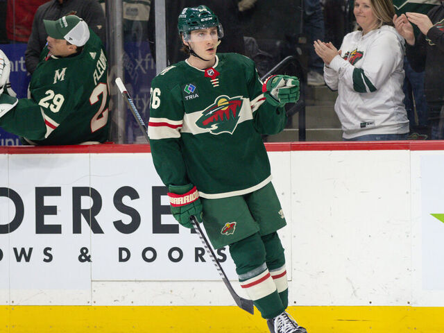 Saint Paul, MN - FEBRUARY 27: Minnesota Wild center Connor Dewar (26) points to goaltender Filip Gustavsson (32) after scoring a goal during the first period of an NHL game between the Carolina Hurricanes and Minnesota Wild on February 27th, 2024, at the Xcel Energy Center in Saint Paul, MN.