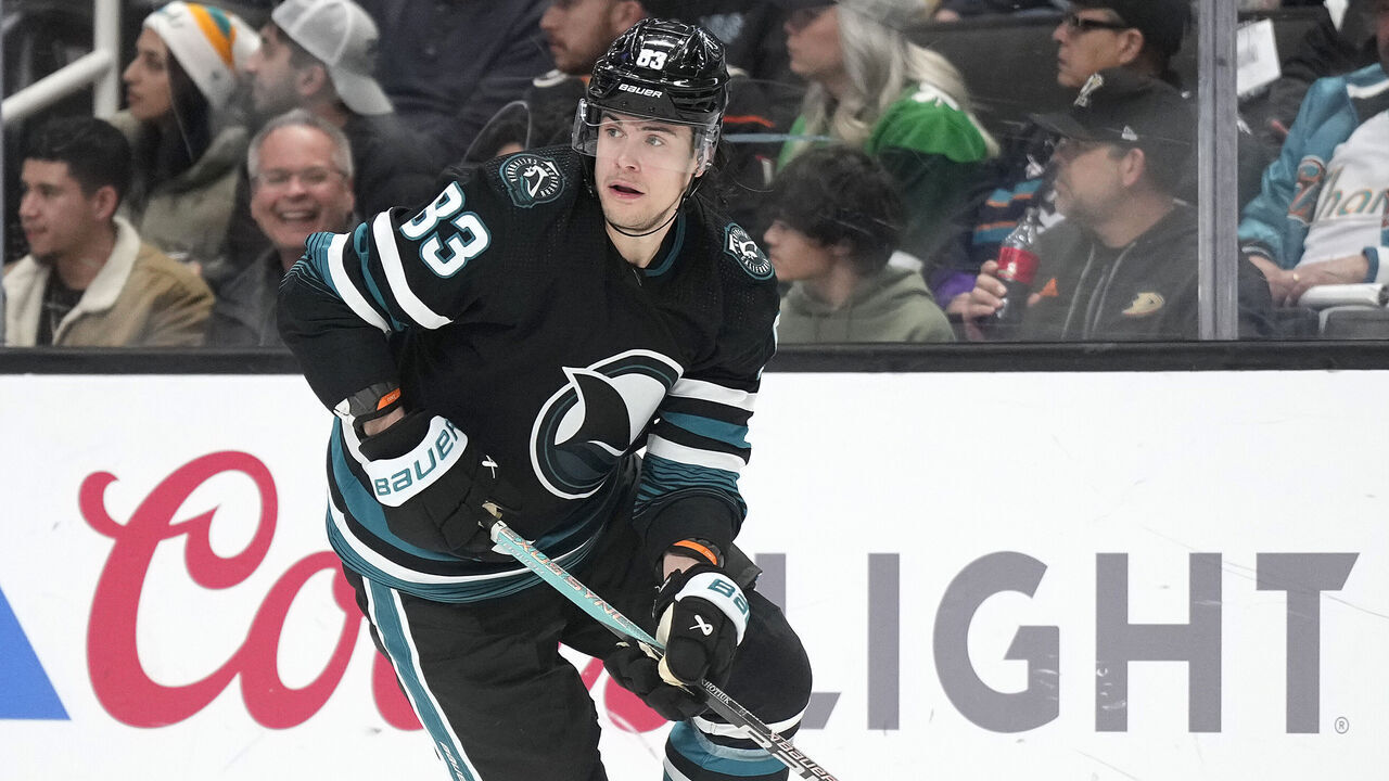 SAN JOSE, CALIFORNIA - FEBRUARY 29: Nikita Okhotiuk #83 of the San Jose Sharks skates with the puck against the Anaheim Ducks in the first period of an NHL hockey game at SAP Center on February 29, 2024 in San Jose, California.