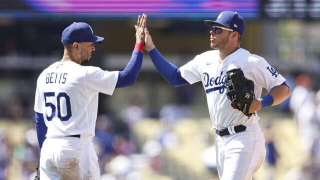 LOS ANGELES, CALIFORNIA - JULY 27: Mookie Betts #50 of the Los Angeles Dodgers celebrates with Gavin Lux #9 after defeating the Washington Nationals, 7-1, during the ninth inning at Dodger Stadium on July 27, 2022 in Los Angeles, California.