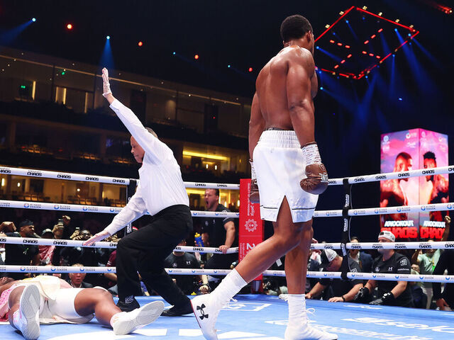 RIYADH, SAUDI ARABIA - MARCH 08: Francis Ngannou is knocked down for the third time as Referee Ricky Gonzalez checks on him during the Heavyweight fight between Anthony Joshua and Francis Ngannou on the Knockout Chaos boxing card at the Kingdom Arena on March 08, 2024 in Riyadh, Saudi Arabia.
