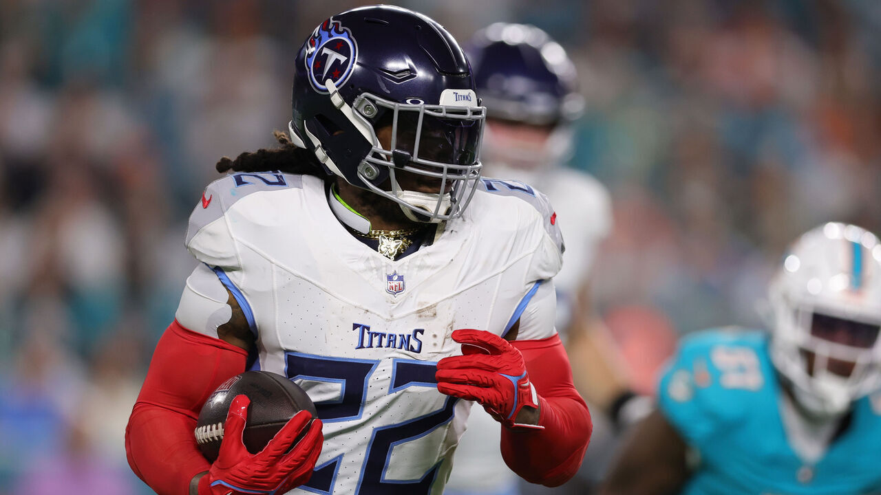 MIAMI GARDENS, FLORIDA - DECEMBER 11: Derrick Henry #22 of the Tennessee Titans runs the ball in the first half against the Miami Dolphins at Hard Rock Stadium on December 11, 2023 in Miami Gardens, Florida.