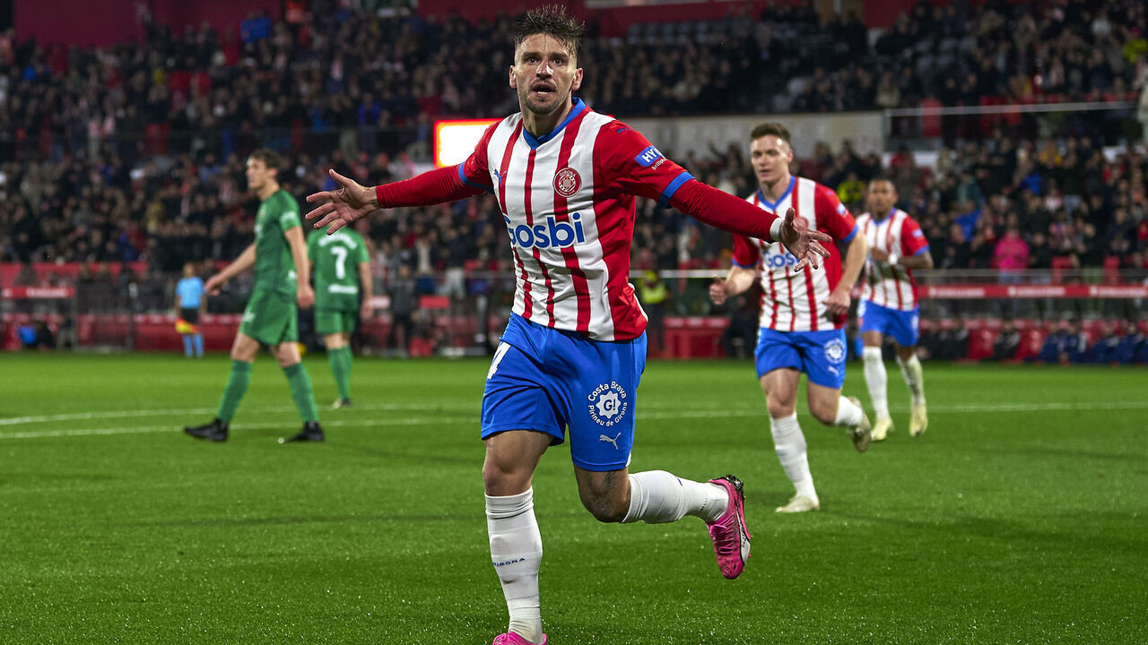 GIRONA, SPAIN - MARCH 09: Cristian Portugues 'Portu' of Girona FC celebrates after scoring his team's first goal during the LaLiga EA Sports match between Girona FC and CA Osasuna at Montilivi Stadium on March 09, 2024 in Girona, Spain.