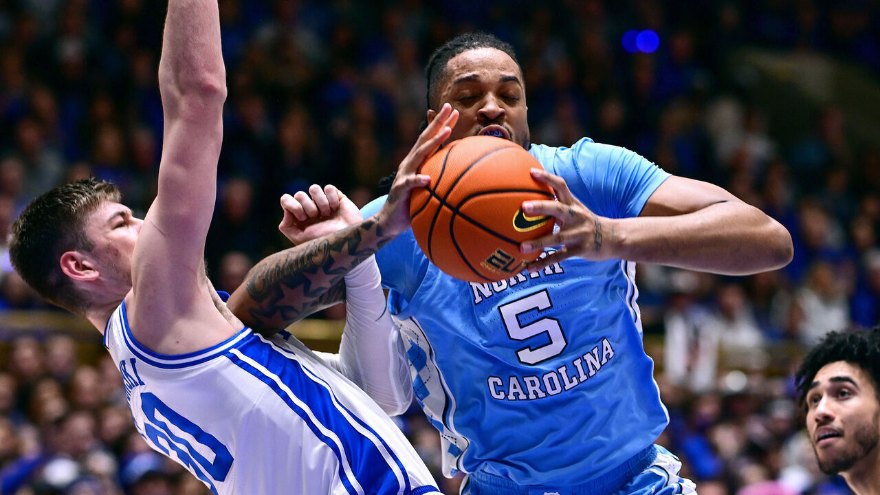 DURHAM, NORTH CAROLINA - MARCH 09: Kyle Filipowski #30 of the Duke Blue Devils defends Armando Bacot #5 of the North Carolina Tar Heels during the first half of the game at Cameron Indoor Stadium on March 09, 2024 in Durham, North Carolina.