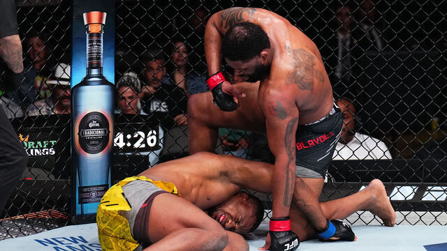 MIAMI, FLORIDA - MARCH 09: Curtis Blaydes punches Jailton Almeida of Brazil in a heavyweight fight during the UFC 299 event at Kaseya Center on March 09, 2024 in Miami, Florida.