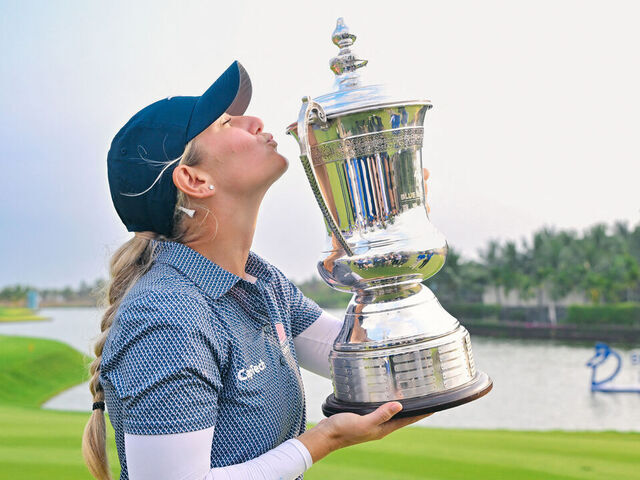USA's Bailey Tardy celebrates with her trophy after winning the LPGA Blue Bay golf tournament at Jian Lake Blue Bay Golf Club in Sanya in China's southern Hainan province on March 10, 2024.