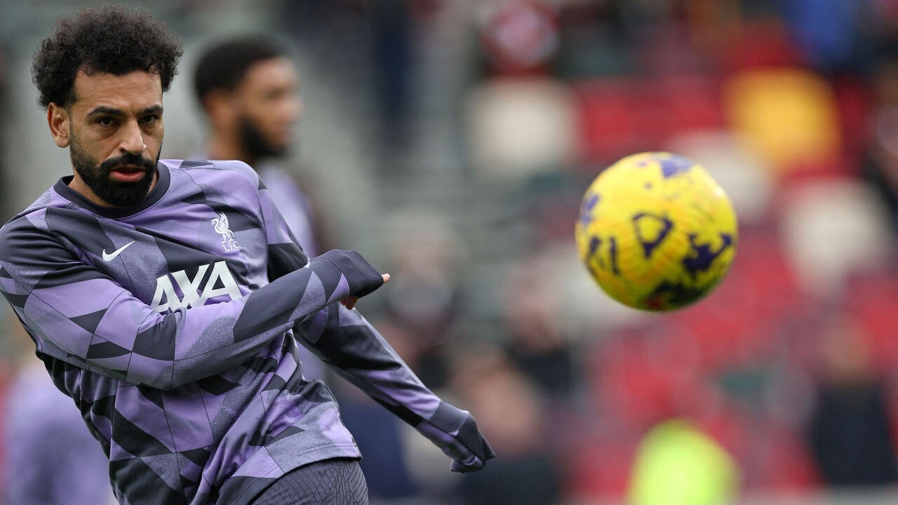 Liverpool's Egyptian striker #11 Mohamed Salah warms up ahead of the English Premier League football match between Brentford and Liverpool at the Gtech Community Stadium in London on February 17, 2024.