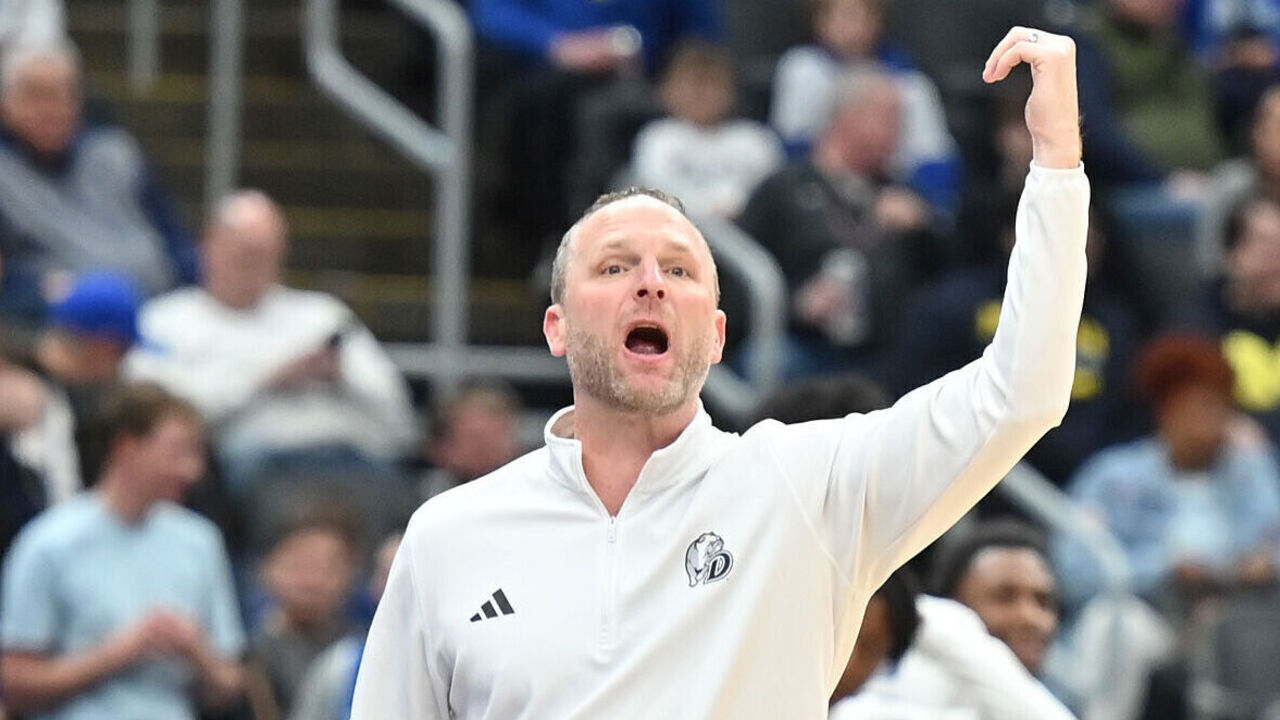 ST. LOUIS, MO - MARCH 09: Drake Bulldogs head coach Darian DeVries gestures to his team during a Missouri Valley Conference Tournament Arch Madness semifinal game between the Bradley Braves and the Drake Bulldogs on March 09, 2024, at Enterprise Center in St. Louis, MO.