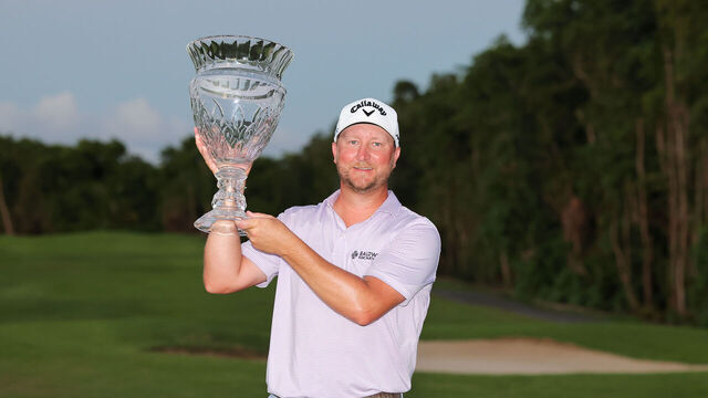 RIO GRANDE, PUERTO RICO - MARCH 10: Brice Garnett of the United States celebrates with the trophy after his win during a four-hole playoff against Erik Barnes (not pictured) of the United States during the final round of the Puerto Rico Open at Grand Reserve Golf Club on March 10, 2024 in Rio Grande, Puerto Rico.