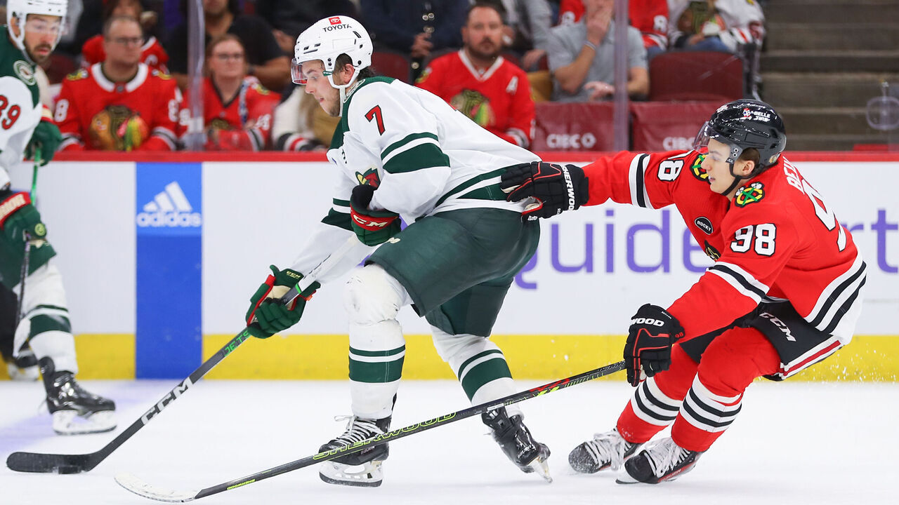 CHICAGO, IL - OCTOBER 05: Chicago Blackhawks center Connor Bedard (98) skates against Minnesota Wild defenseman Brock Faber (7) during overtime during a game between the Minnesota Wild and the Chicago Blackhawks on October 5, 2023 at the United Center in Chicago, IL.