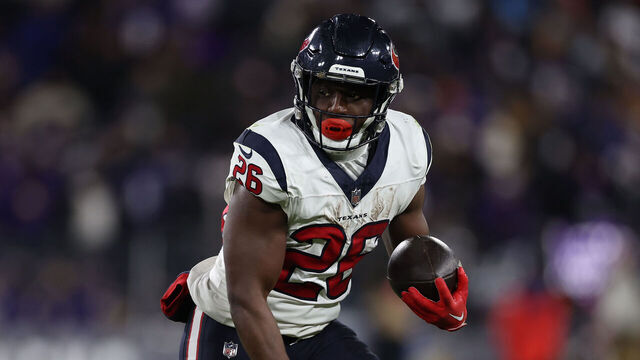 BALTIMORE, MARYLAND - JANUARY 20: Running back Devin Singletary #26 of the Houston Texans rushes against the Baltimore Ravens in the AFC Divisional Playoff game at M&T Bank Stadium on January 20, 2024 in Baltimore, Maryland.
