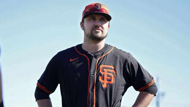 SCOTTSDALE, ARIZONA - FEBRUARY 19: J.D. Davis (R) of the San Francisco Giants talks during the San Francisco Giants Spring Training workout at Scottsdale Stadium on February 19, 2024 in Scottsdale, Arizona.