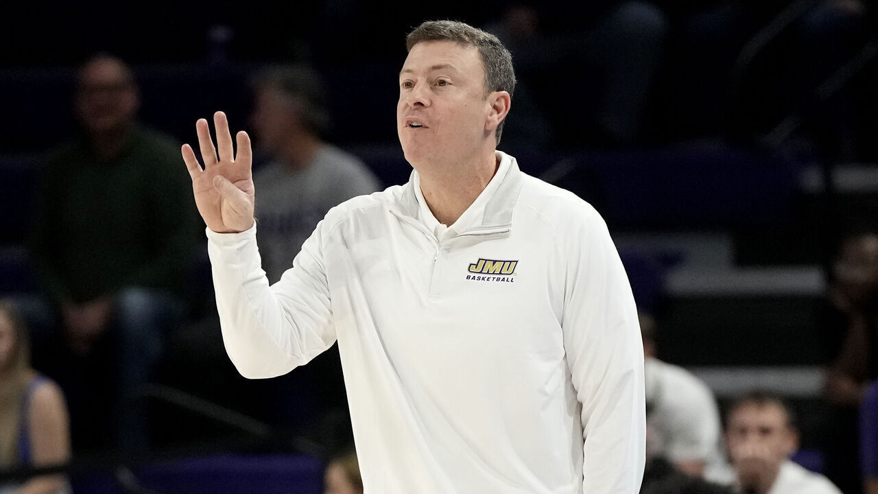 HARRISONBURG, VA - JANUARY 11: Head coach Mark Byington of the James Madison Dukes signals to his players during a college basketball game against the South Alabama Jaguars at the Atlantic Union Bank Center on January 11, 2024 in Harrisonburg, Virginia.