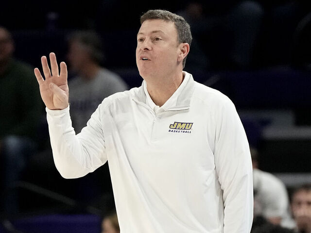 HARRISONBURG, VA - JANUARY 11: Head coach Mark Byington of the James Madison Dukes signals to his players during a college basketball game against the South Alabama Jaguars at the Atlantic Union Bank Center on January 11, 2024 in Harrisonburg, Virginia.
