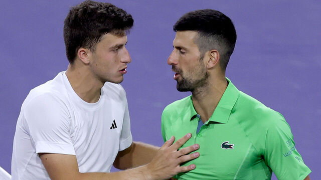 INDIAN WELLS, CALIFORNIA - MARCH 11: Luca Nardi of Italy is congratulated by Novak Djokovic of Serbia after their match during the BNP Paribas Open at Indian Wells Tennis Garden on March 11, 2024 in Indian Wells, California.