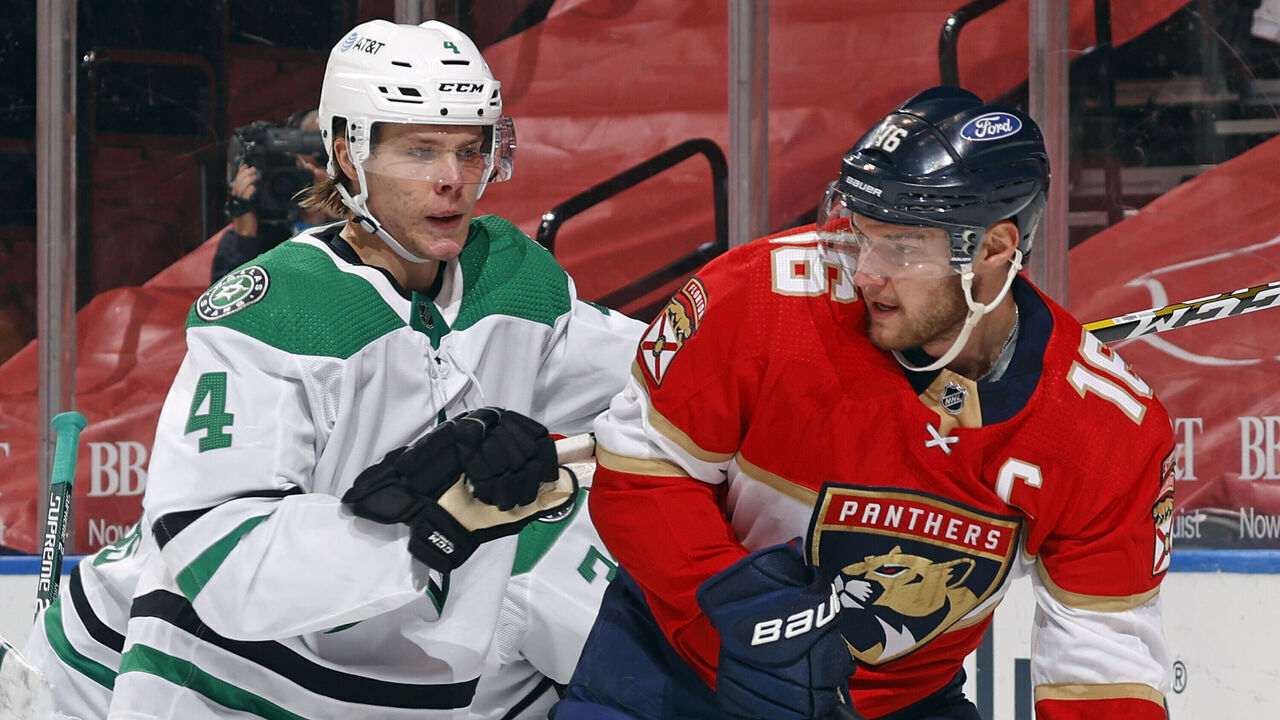 SUNRISE, FL - FEBRUARY 22: Miro Heiskanen #4 of the Dallas Stars checks Aleksander Barkov #16 of the Florida Panthers in front of the net at the BB&T Center on February 22, 2021 in Sunrise, Florida.