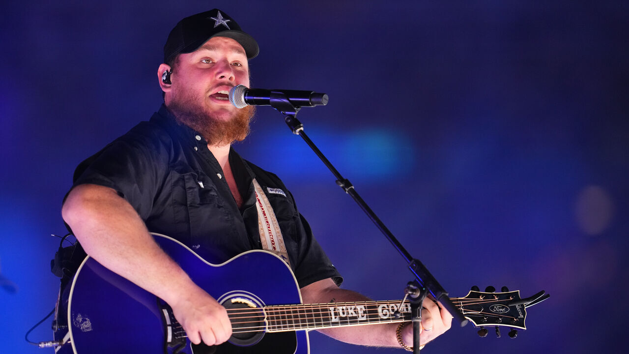 ARLINGTON, TEXAS - NOVEMBER 25: Luke Combs performs during the halftime show between the Dallas Cowboys and the Las Vegas Raiders during an NFL game at AT&T Stadium on November 25, 2021 in Arlington, Texas.