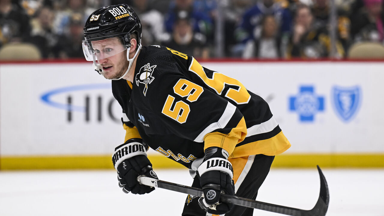 PITTSBURGH, PA - JANUARY 11: Pittsburgh Penguins left wing Jake Guentzel (59) looks on during the second period in the NHL game between the Pittsburgh Penguins and the Vancouver Canucks on January 11, 2024, at PPG Paints Arena in Pittsburgh, PA.
