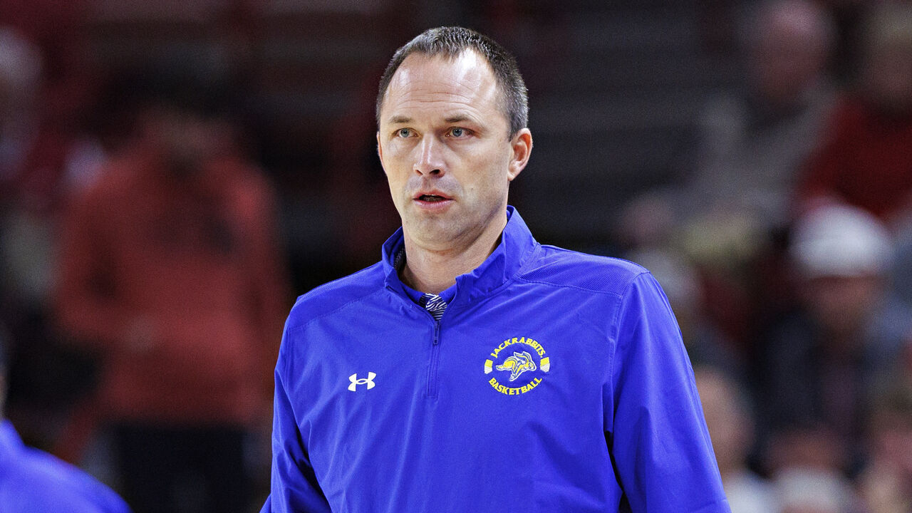 FAYETTEVILLE, ARKANSAS - NOVEMBER 16: Head Coach Eric Henderson of the South Dakota State Jackrabbits watches his team during a game against the Arkansas Razorbacks at Bud Walton Arena on November 16, 2022 in Fayetteville, Arkansas. The Razorbacks defeated the Jackrabbits 71-56.