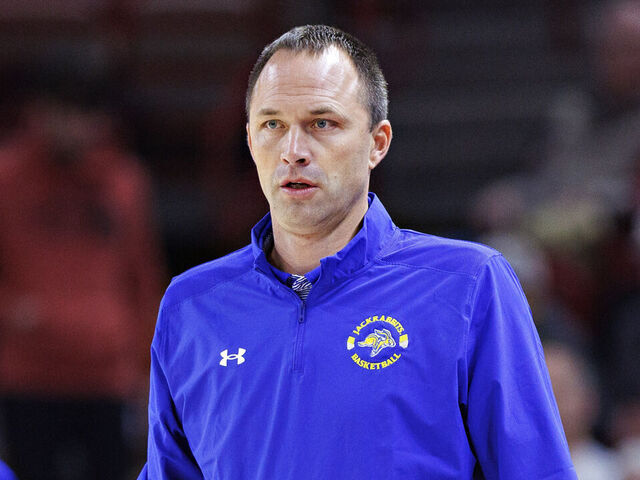 FAYETTEVILLE, ARKANSAS - NOVEMBER 16: Head Coach Eric Henderson of the South Dakota State Jackrabbits watches his team during a game against the Arkansas Razorbacks at Bud Walton Arena on November 16, 2022 in Fayetteville, Arkansas. The Razorbacks defeated the Jackrabbits 71-56.