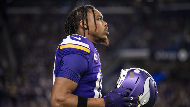 MINNEAPOLIS, MINNESOTA - DECEMBER 31: Justin Jefferson #18 of the Minnesota Vikings warms up before the game against the Green Bay Packers at U.S. Bank Stadium on December 31, 2023 in Minneapolis, Minnesota.