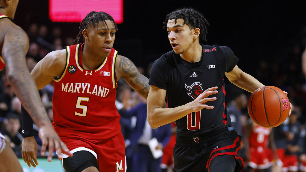 PISCATAWAY, NEW JERSEY - FEBRUARY 25: Derek Simpson #0 of the Rutgers Scarlet Knights in action against DeShawn Harris-Smith #5 of the Maryland Terrapins during a game at Jersey Mike's Arena on February 25, 2024 in Piscataway, New Jersey. Maryland defeated Rutgers 63-46.