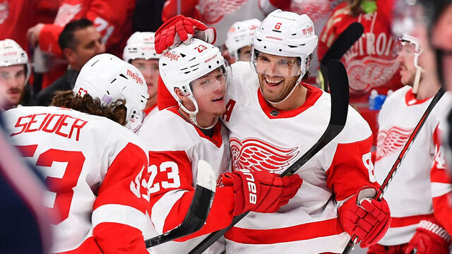 COLUMBUS, OHIO - NOVEMBER 19: Ben Chiarot #8 of the Detroit Red Wings celebrates his second period goal with teammates Lucas Raymond #23 and Moritz Seider #53 of the Detroit Red Wings during a game against the Columbus Blue Jackets at Nationwide Arena on November 19, 2022 in Columbus, Ohio.