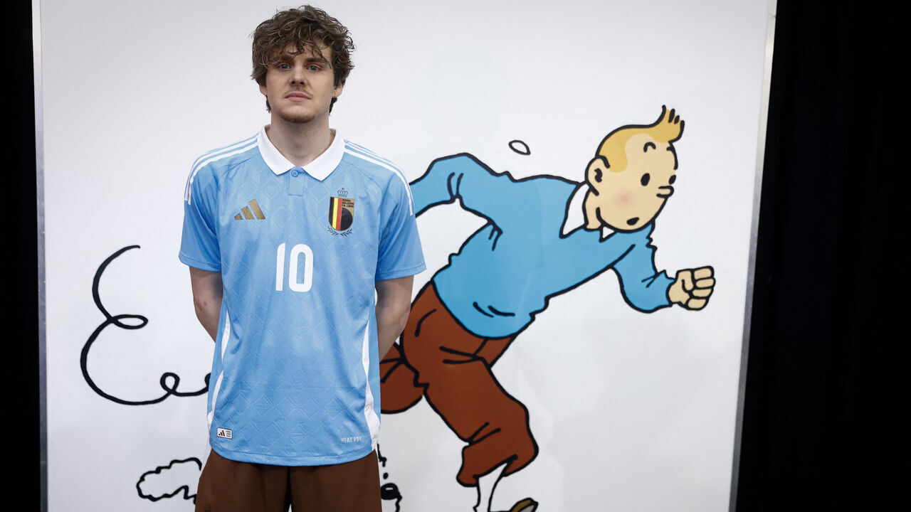 A model presents the Belgian football team's new away jersey paying tribute to Belgian comics series character Tintin at the Herge Museum in Louvain-La-Neuve on March 14, 2024.