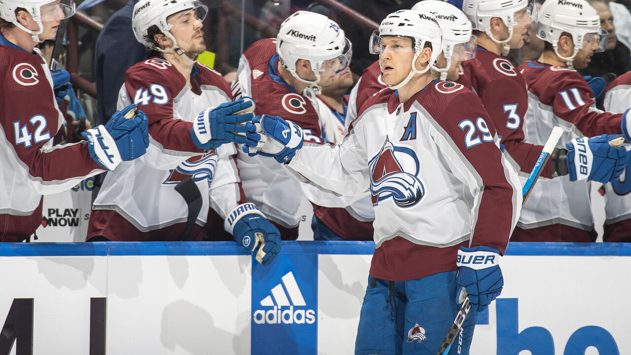 VANCOUVER, CANADA - MARCH 13: Nathan MacKinnon #29 of the Colorado Avalanche celebrates his goal with teammates during the third period of their NHL game against the Vancouver Canucks at Rogers Arena on March 13, 2024 in Vancouver, British Columbia, Canada.