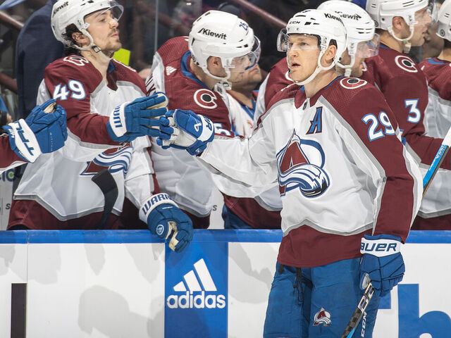 VANCOUVER, CANADA - MARCH 13: Nathan MacKinnon #29 of the Colorado Avalanche celebrates his goal with teammates during the third period of their NHL game against the Vancouver Canucks at Rogers Arena on March 13, 2024 in Vancouver, British Columbia, Canada.