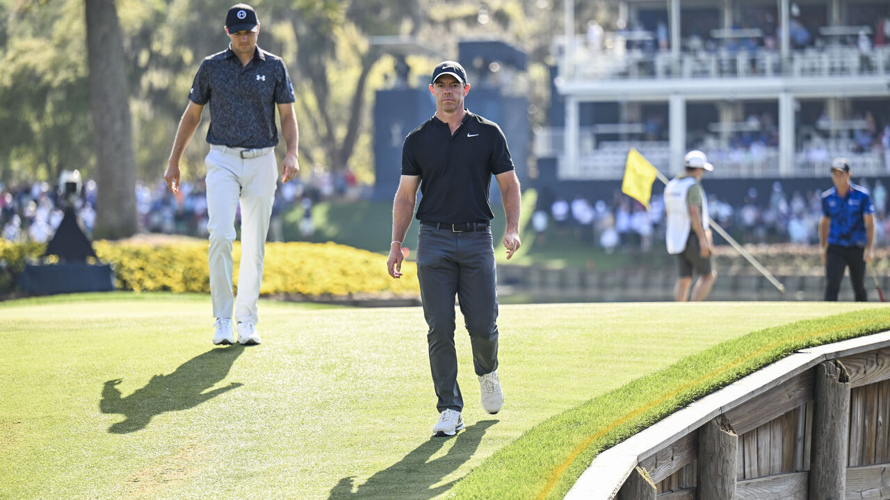 PONTE VEDRA BEACH, FLORIDA - MARCH 14: Rory McIlroy of Northern Ireland walks off the 17th hole green after making a birdie putt ahead of Jordan Spieth during the first round of THE PLAYERS Championship on the Stadium Course at TPC Sawgrass on March 14, 2024, in Ponte Vedra Beach, Florida.