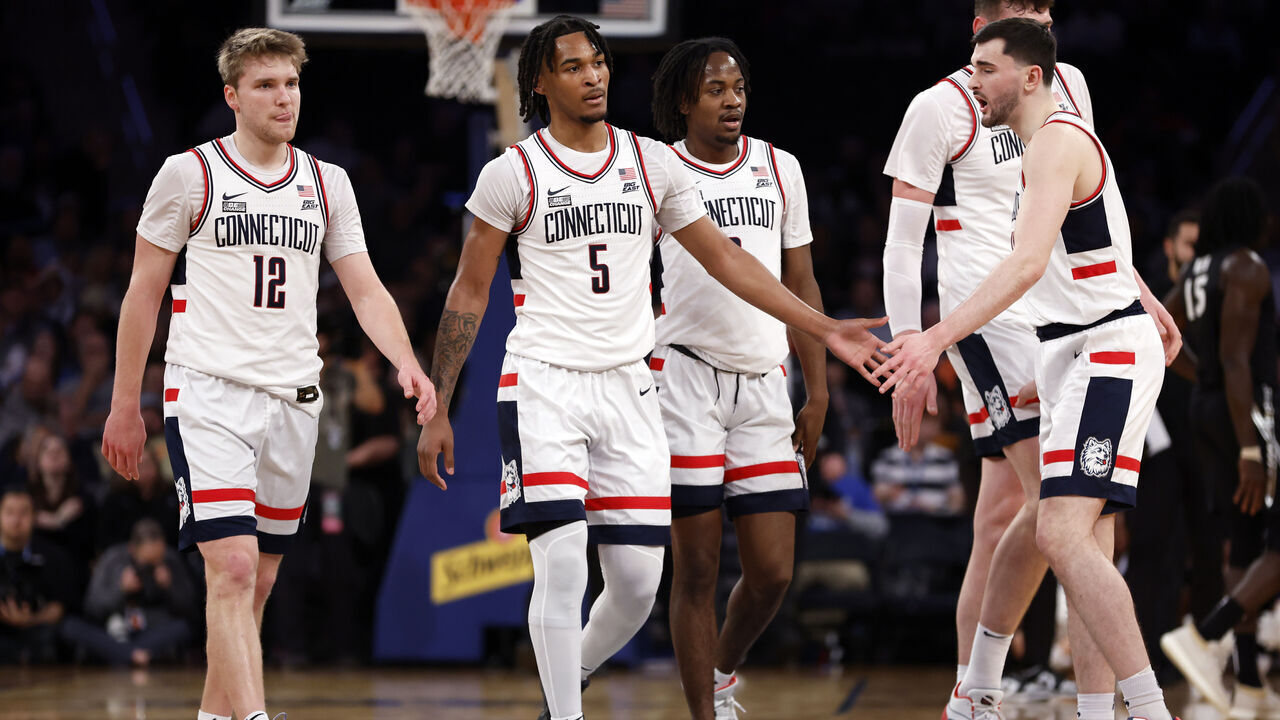 NEW YORK, NEW YORK - MARCH 14: Cam Spencer #12, Stephon Castle #5, and Alex Karaban #11 of the Connecticut Huskies react in the first half against the Xavier Musketeers during the Quarterfinals of the Big East Basketball Tournament at Madison Square Garden on March 14, 2024 in New York City.
