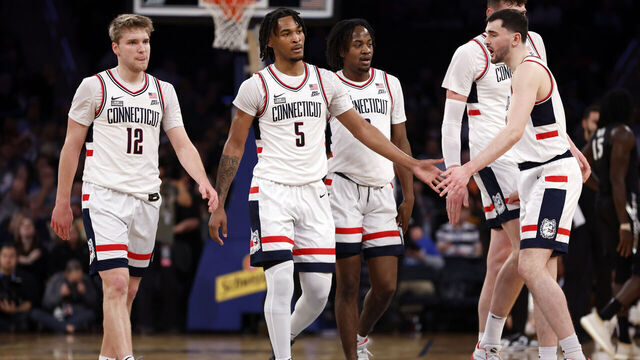 NEW YORK, NEW YORK - MARCH 14: Cam Spencer #12, Stephon Castle #5, and Alex Karaban #11 of the Connecticut Huskies react in the first half against the Xavier Musketeers during the Quarterfinals of the Big East Basketball Tournament at Madison Square Garden on March 14, 2024 in New York City.