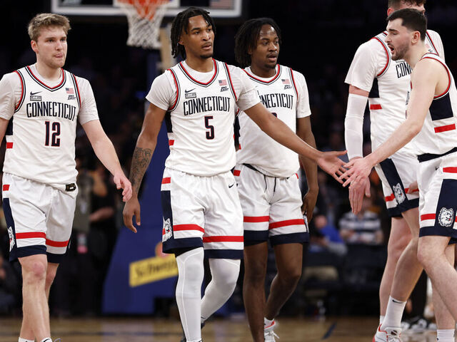NEW YORK, NEW YORK - MARCH 14: Cam Spencer #12, Stephon Castle #5, and Alex Karaban #11 of the Connecticut Huskies react in the first half against the Xavier Musketeers during the Quarterfinals of the Big East Basketball Tournament at Madison Square Garden on March 14, 2024 in New York City.