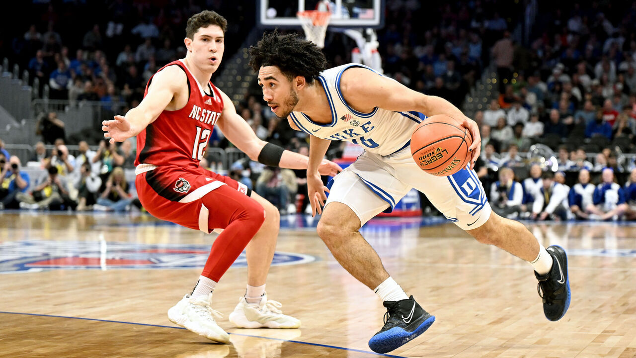 WASHINGTON, DC - MARCH 14: Jared McCain #0 of the Duke Blue Devils handles the ball in the first half against Michael O'Connell #12 of the North Carolina State Wolfpack in the Quarterfinals of the ACC Men's Basketball Tournament at Capital One Arena on March 14, 2024 in Washington, DC.