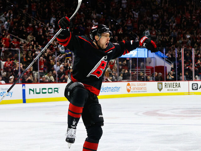 RALEIGH, NC - MARCH 14: Evgeny Kuznetsov #92 of the Carolina Hurricanes celebrates a goal during the second period of the game against the Florida Panthers at PNC Arena on March 14, 2024 in Raleigh, North Carolina.
