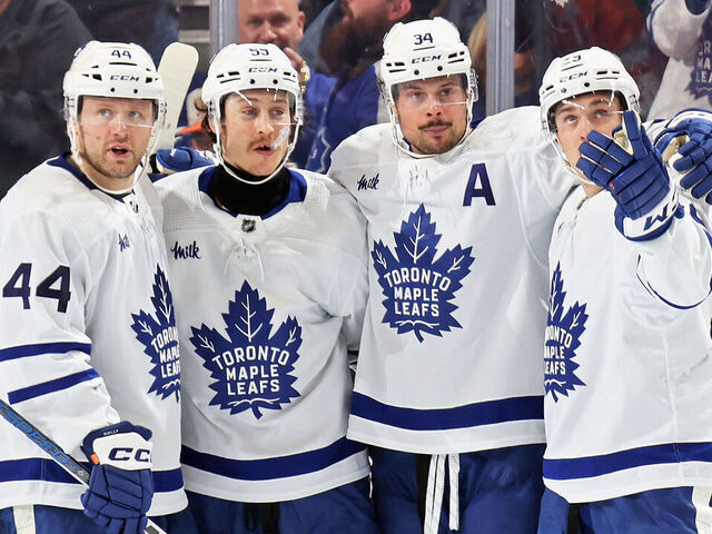 PHILADELPHIA, PENNSYLVANIA - MARCH 14: Auston Matthews #34 of the Toronto Maple Leafs celebrates his third period goal against the Philadelphia Flyers with Morgan Rielly #44, Tyler Bertuzzi #59, and Pontus Holmberg #29 at the Wells Fargo Center on March 14, 2024 in Philadelphia, Pennsylvania.
