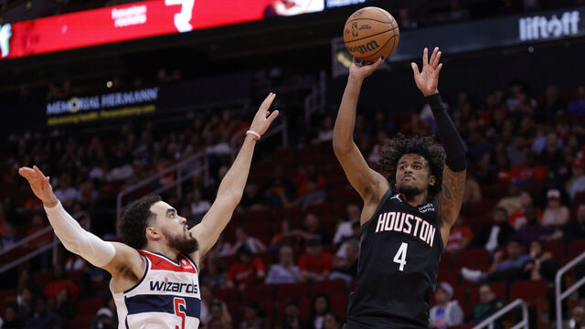 HOUSTON, TEXAS - MARCH 14: Jalen Green #4 of the Houston Rockets shoots over Tyus Jones #5 of the Washington Wizards during the second half at Toyota Center on March 14, 2024 in Houston, Texas.