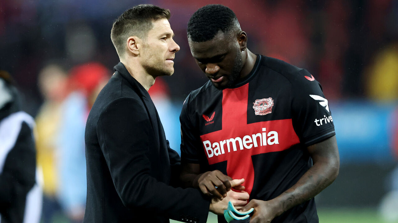 LEVERKUSEN, GERMANY - DECEMBER 20: Xabi Alonso, Head Coach of Bayer Leverkusen, interacts with Victor Boniface of Bayer Leverkusen after the Bundesliga match between Bayer 04 Leverkusen and VfL Bochum 1848 at BayArena on December 20, 2023 in Leverkusen, Germany.