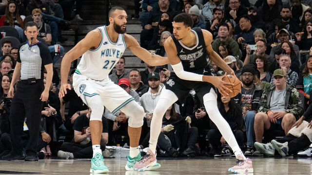 TOPSHOT - Minnesota Timberwolves' French center #27 Rudy Gobert guards San Antonio Spurs' French forward #01 Victor Wembanyama during the NBA game between the San Antonio Spurs and the Minnesota Timberwolves at the Frost Bank Center in San Antonio, Texas, on January 27, 2024.