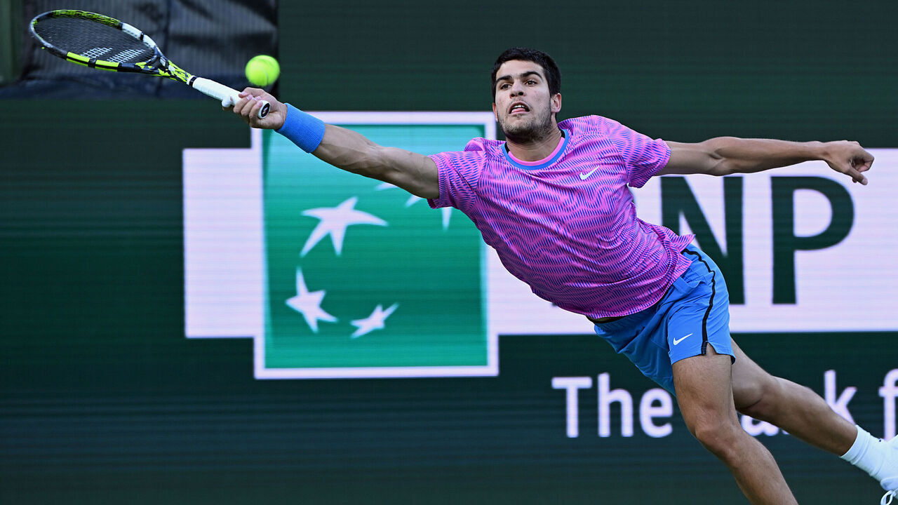 INDIAN WELLS, CA - MARCH 14: Carlos Alcaraz (ESP) dives for the ball during a ATP quarterfinals tennis match played on March 14, 2024 during the BNP Paribas Open played at the Indian Wells Tennis Garden in Indian Wells, CA.