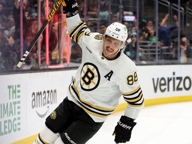 SEATTLE, WASHINGTON - FEBRUARY 26: David Pastrnak #88 of the Boston Bruins celebrates his goal and 700th NHL point during the first period against the Seattle Kraken at Climate Pledge Arena on February 26, 2024 in Seattle, Washington.