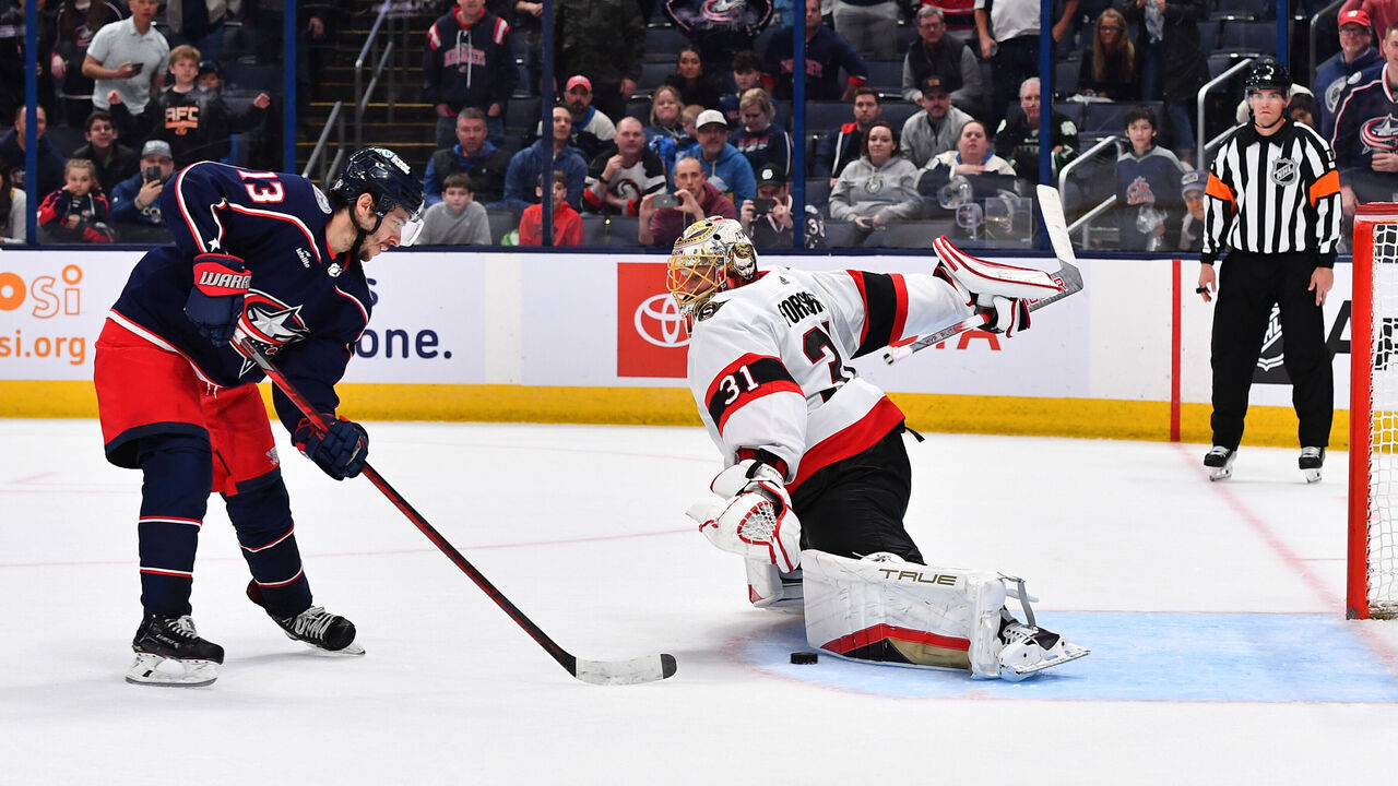 COLUMBUS, OHIO - MARCH 14: Goaltender Anton Forsberg #31 of the Ottawa Senators blocks a shot taken by Johnny Gaudreau #13 of the Columbus Blue Jackets during a shootout at Nationwide Arena on March 14, 2024 in Columbus, Ohio.