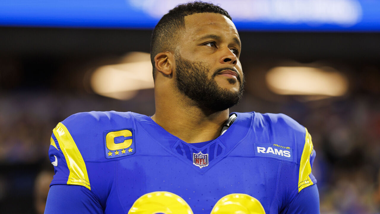 INGLEWOOD, CA - DECEMBER 21: Aaron Donald #99 of the Los Angeles Rams looks on from the sideline before an NFL game against the New Orleans Saints at SoFi Stadium on December 21, 2023 in Inglewood, California.