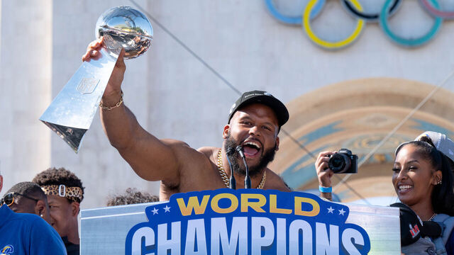 Los Angeles, CA - February 16:Aaron Donald with the Lombardi trophy at the LA Rams celebrated their Super Bowl win at the Los Angeles Memorial Coliseum Wednesday, February 16, 2022. Los Angeles mayor Eric Garcetti declared Wednesday Rams Day in Los Angeles.